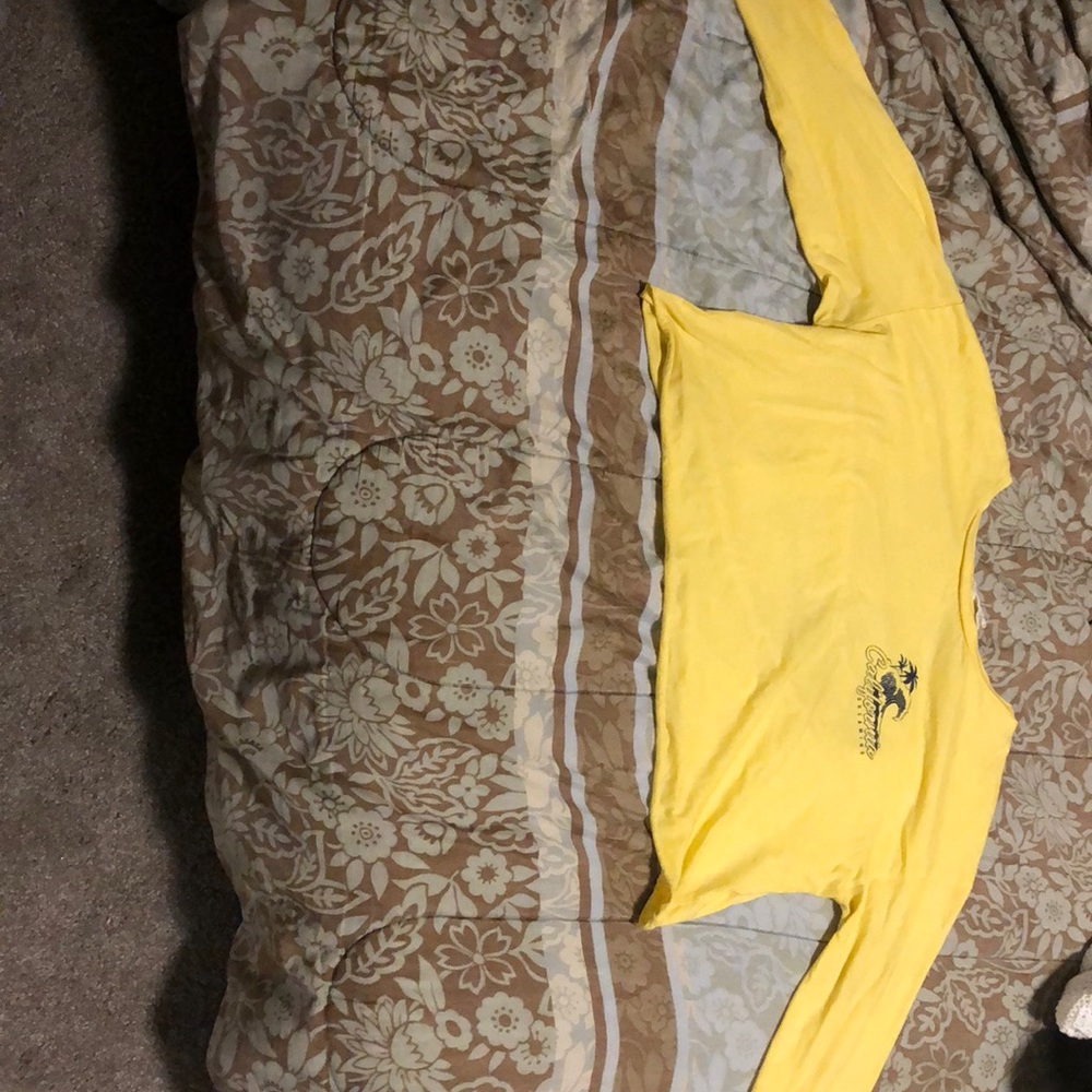 A yellow long sleeve tee